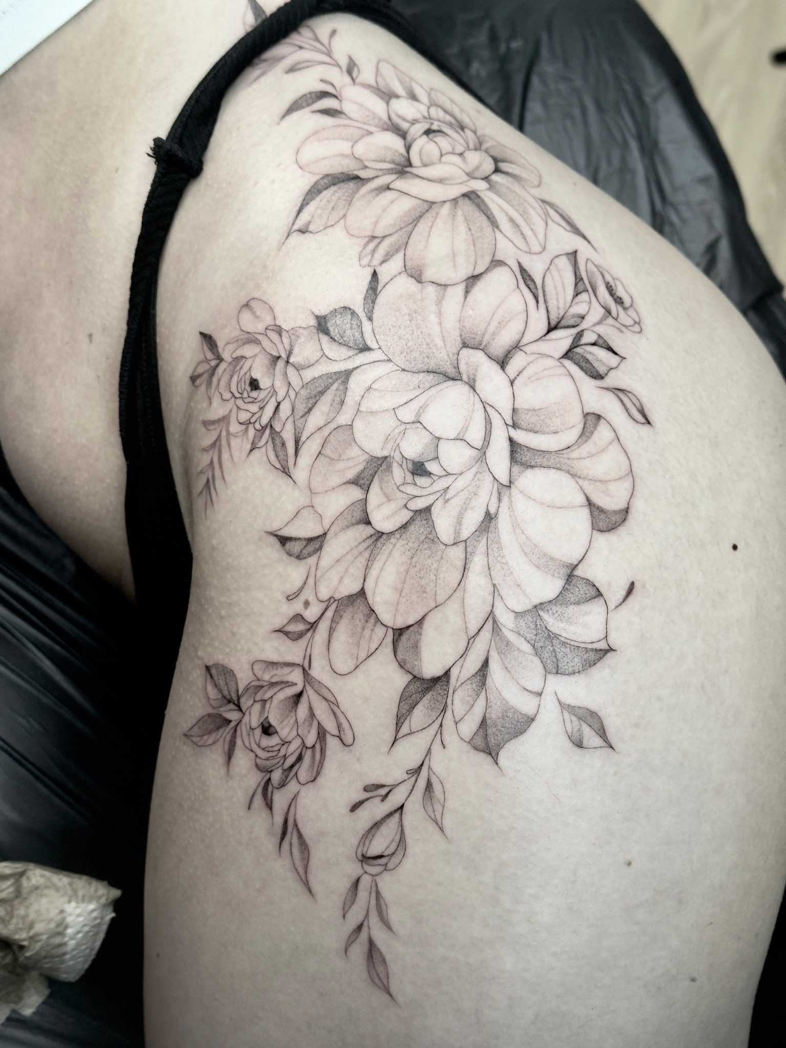 Fineline floral back and hip tattoo