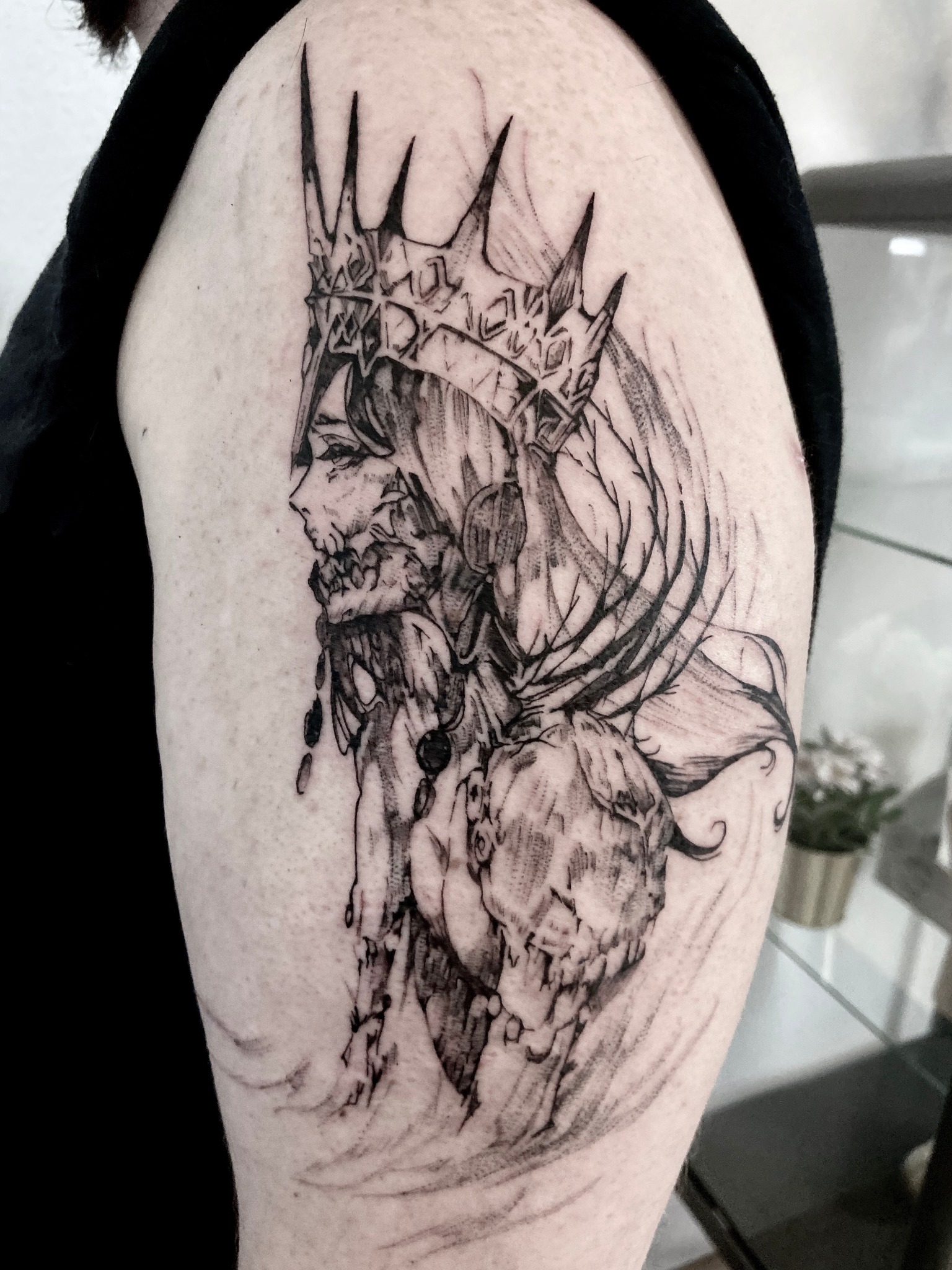 Sketch-style crowned skull tattoo
