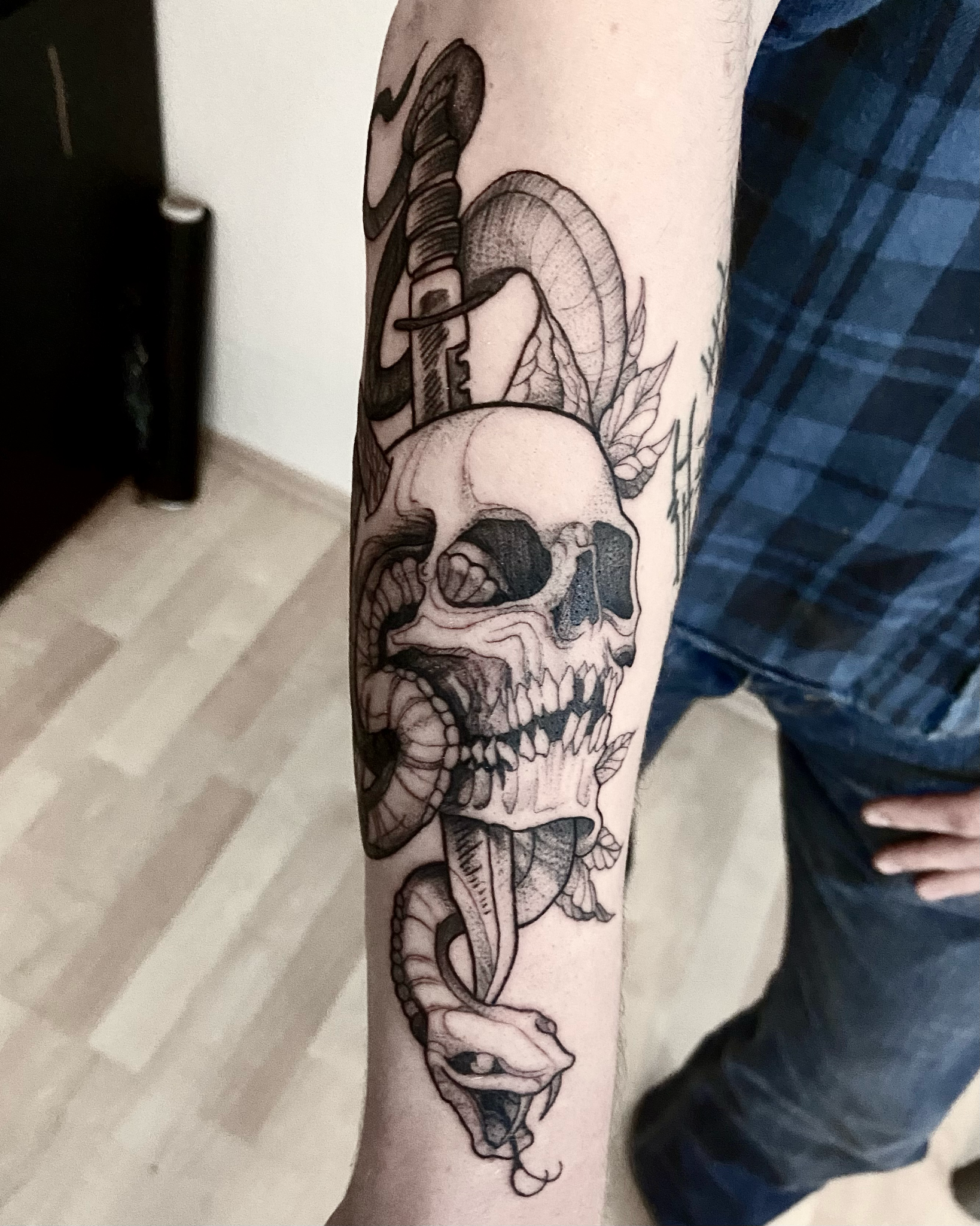 Black and grey skull and snake tattoo